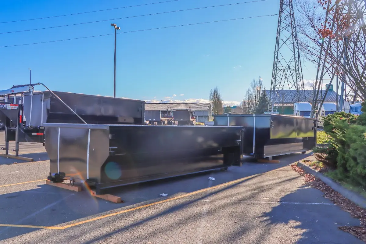 Roll-off dumpster ready for waste disposal at job site for Concrete Dumpster Rental in Prunedale